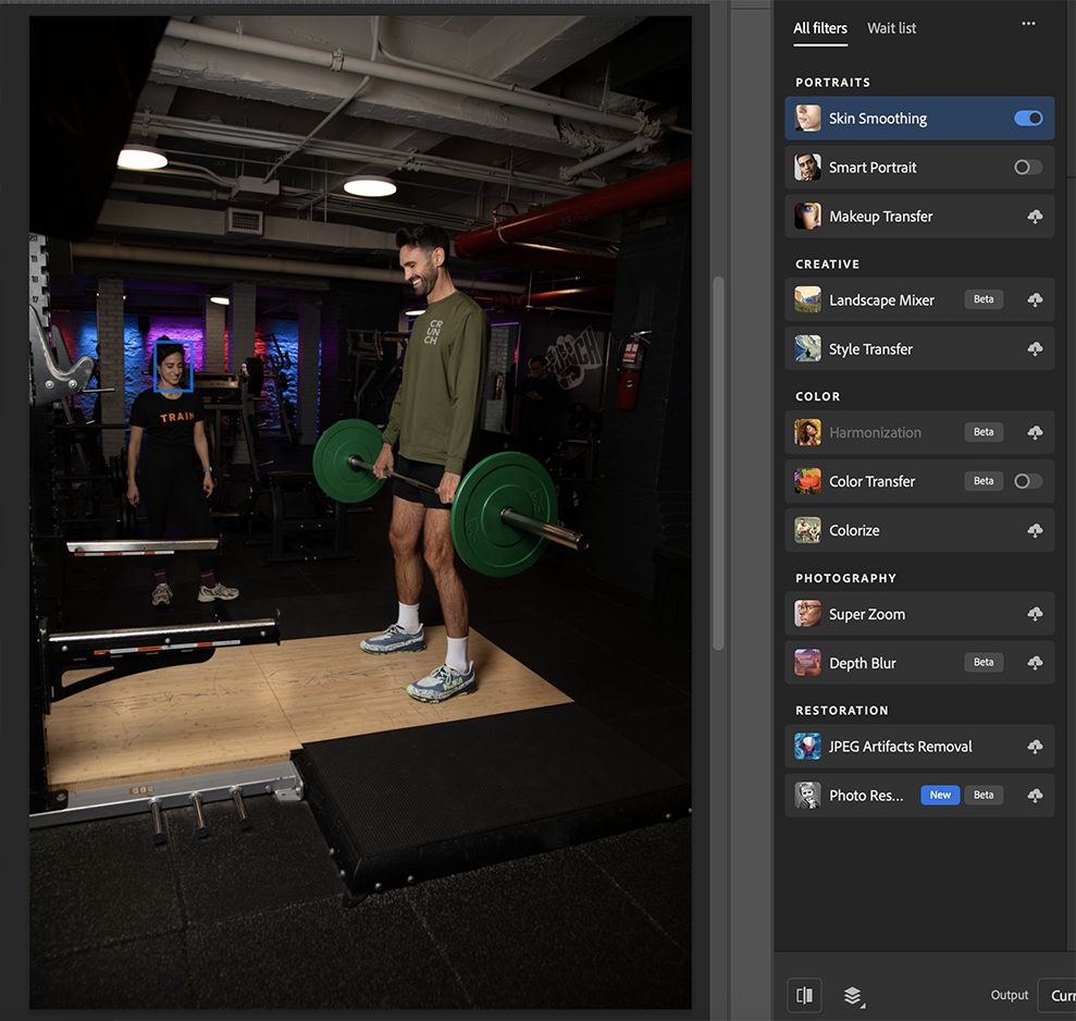 trainer stands near platform while man holds heavy weights