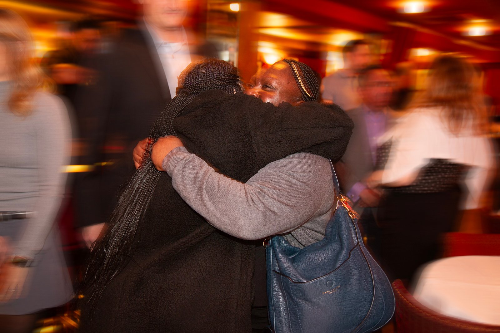 Cruncher of the Year recipient greets another woman at party
