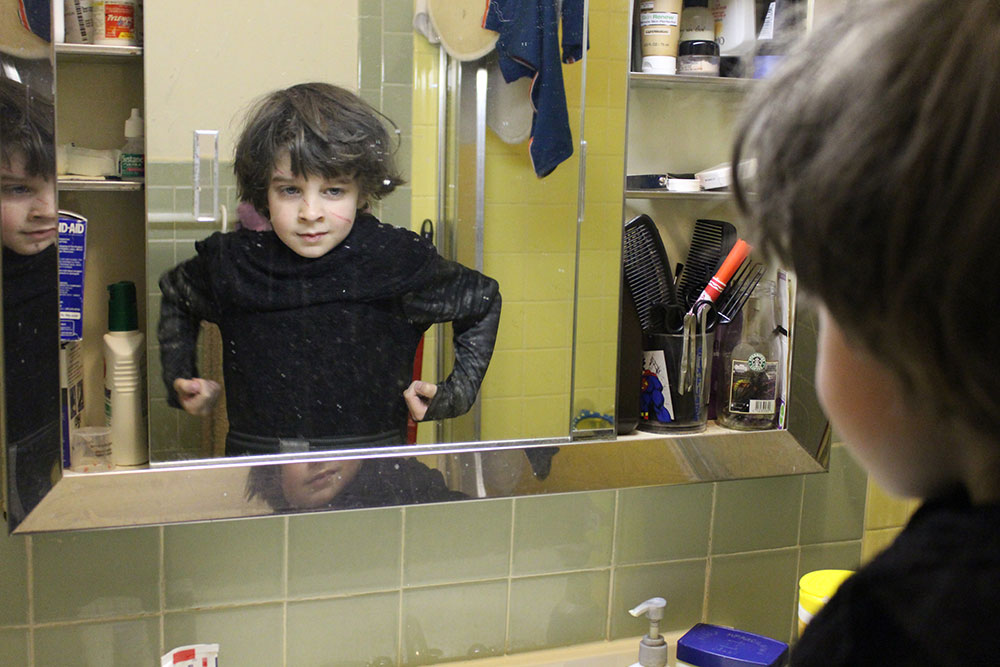 Kal models his Kylo Ren costume in messy bathroom mirror